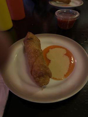 Egg roll side of hot mustard and duck sauce.