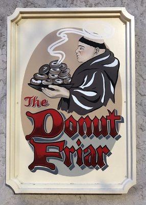 The Donut Friar, by my personal re-collection, has been in this exact same spot for over fifty years, and is just as good as ever.