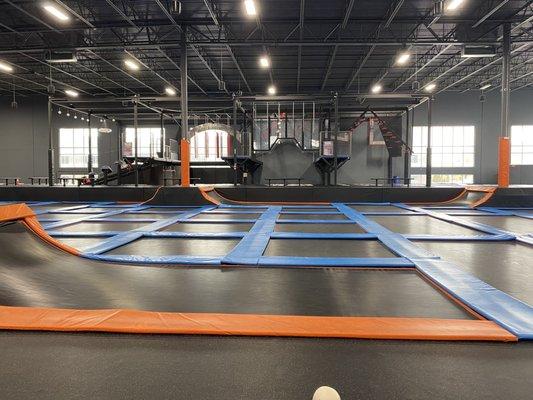 Trampolines with ninja course in background