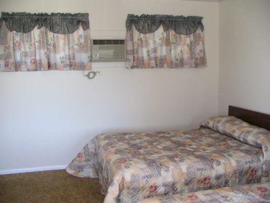 Front motel near pool with Queen bed and Double bed.