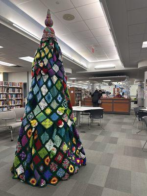 Handmade crochet tree. Almost 10 feet tall with the topper. 8' without topper.  4 feet wide.