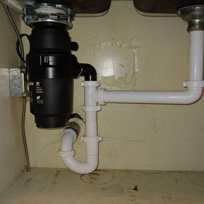 Drain repair and garbage disposal installation