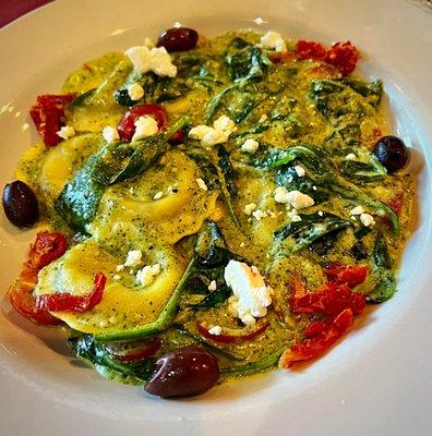 Mediterranean Ravioli: Cheese ravioli in a creamy pesto sauce with sun dried tomatoes, spinach, olives and goat cheese. Very tasty.