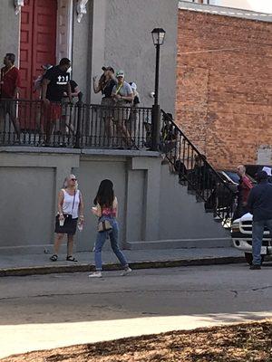 Group of white tourist entering the African Church that we were refused entry just 5 minutes earlier.