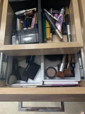 Inside drawers. Double layered.  Created partisans for makeup.  He's so creative!