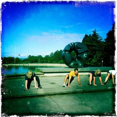 Stretching by the Black Sun with a view of the Space Needle