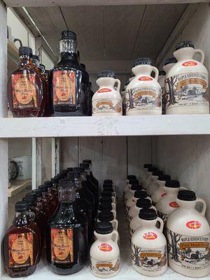 Owner of Queen Bee Artisan Market with her Trainor family maple syrup from Wisconsin.