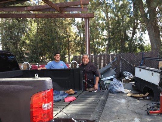 Father and son working on the truck..