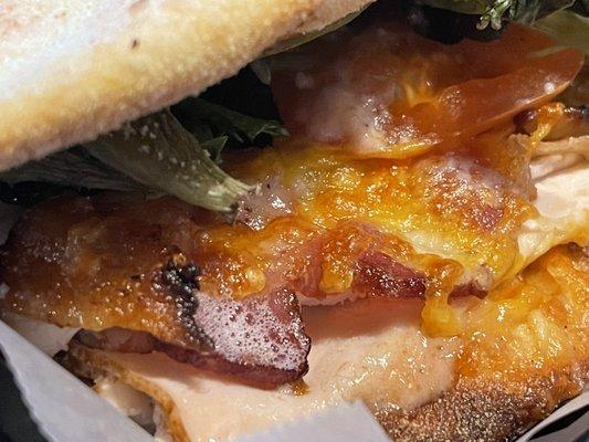 Lettuce, tomato, cheddar, Turkey and still sizzling bacon stars enveloped in crispy chewy woodfired goodness