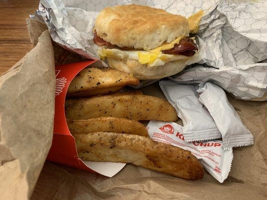 Bacon, Egg & Cheese Biscuit with Seasoned Potatoes. Not worth the 20 min wait at Wendy's after pre-ordering said meal via the Wendy's app