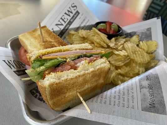 Ham Sandwich with potato chips on the side