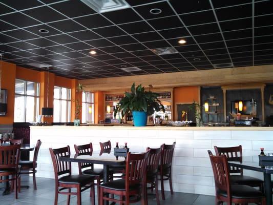 Both seating surrounds the dining area and the bar is divided, drinks on the left and sushi on the right.