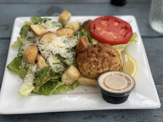 Caesar salad with crabcake burger