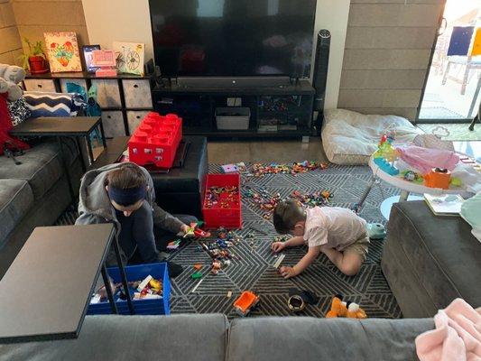 Nanny and child playing legos