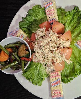 Lobster salad on tomato with side of veggies