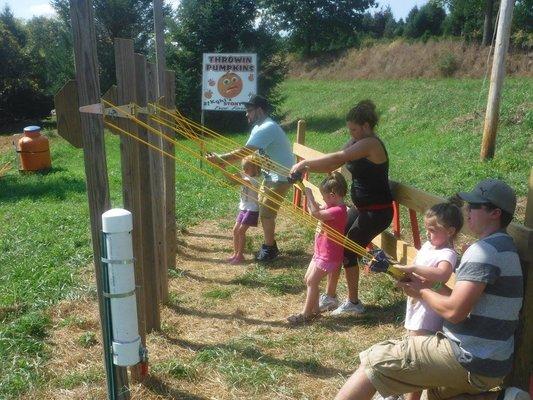 Use sling shots to chunk pumpkins during the fall.