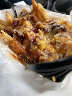 Chili cheese fries with extra shredded cheese