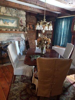 Our farmhouse dining room with beautiful linen slipcovers.