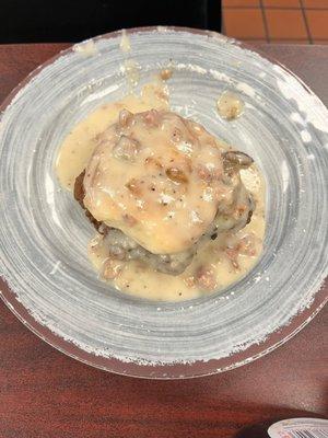 Chicken fried steak biscuit sandwich with sausage gravy