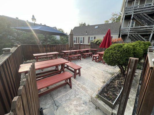 Outdoor patio seating with newly painted picnic benches