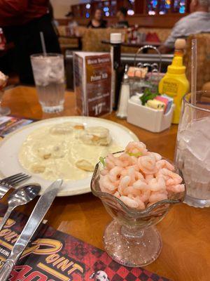 Bay shrimp, shredded lettuce, and cocktail sauce with two buttermilk biscuit and country gravy.