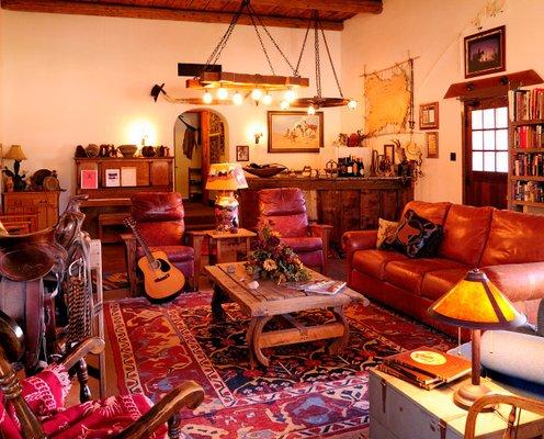 The living room of the main historic lodge; guests can hang out in the evening for cowboy singalong, or just chill.  Home on the range.