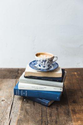 cappuccino on a stack of books