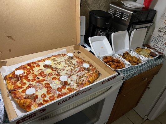 Calzilla pizza and wings....