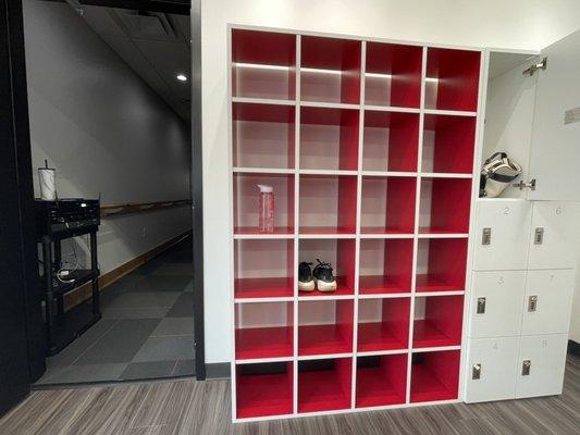 Inside , entryway into studio, Open Cubicle space for items, watched over by desk attendee