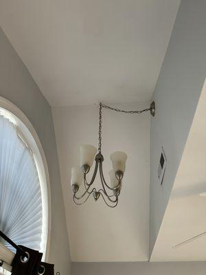 Smartwire360's team reattached the light fixture using a 2x4 inside the attic to keep the light secure.