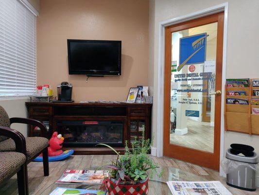 Nicely waiting room with a  cozy fireplace