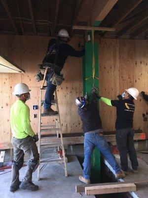 Nieto Valle Construction installing and leveling the more than 400- pound SkinnyBrace, 2/25/2021.