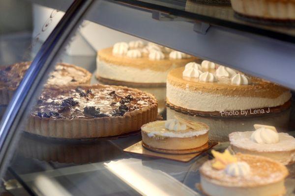 Thanksgiving tarts and pumpkin ginger cheesecake on display