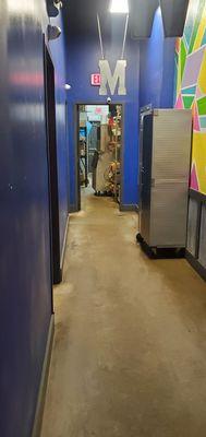 Restroom hallway showing dirty hall and storage room.