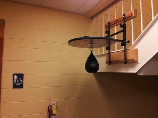 Why is the speed bag hanging off a stairwell in front ofthe entrance to the mens locker room......?