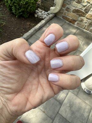 Pretty light lavender with glitter topcoat.  Dip color by Sakura