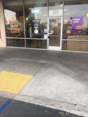 Open store sign during business hours in a closed store.