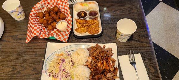 R12 chicken, pork and beef rice plate, fried mushrooms, and salad roll with gyoza.