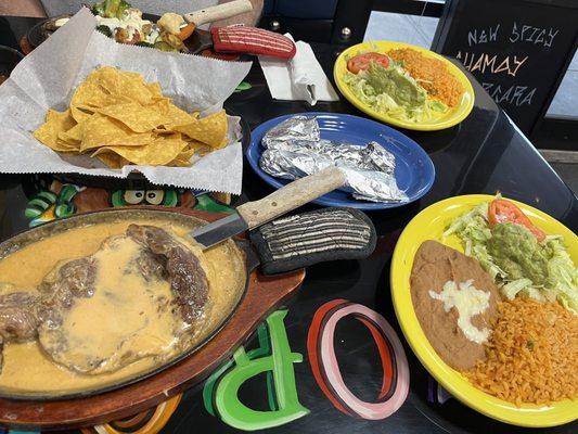 Steak Chipotle with rice & beans, guac salad & 3 flour tortillas in each foil pack - yum!