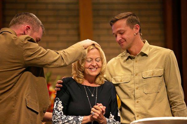 Tony Johnson and Seth Lochmueller pray during a baptism at our Lifehouse Huntertown Campus.