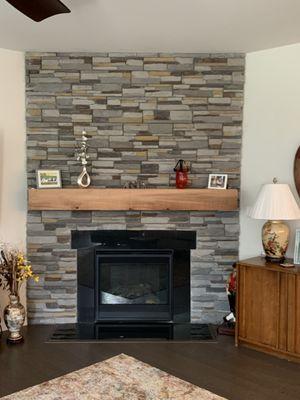 Chimney upfit. Veneer stone and mantle installation.