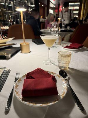 Place setting and a Palace Sour cocktail