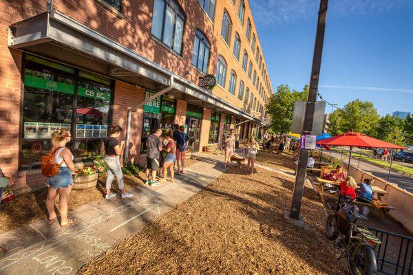 Order outside at our beer window and sit/walk in the social district!