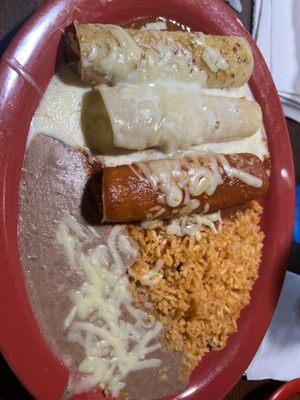 Enchiladas - one chicken, beef, and cheese with red, quest, and green sauce.