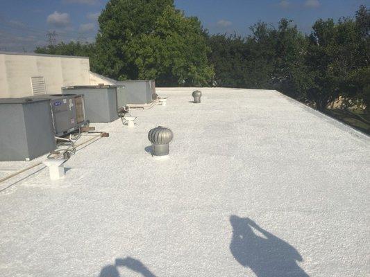 NovaTuff coating application over washed gravel roof.