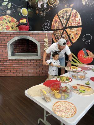 Father and son making "pizza" together