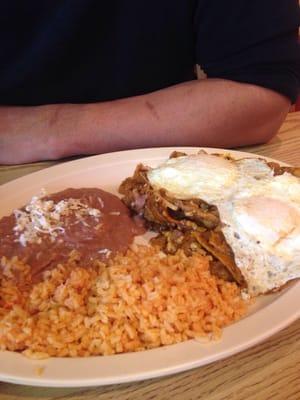 Chilaquiles rojos with fried eggs. Yum. Very spicy.