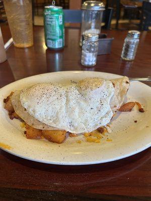 Potato and chorizo, bean, cheese, with 2 fried eggs over medium.