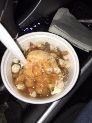 Vanilla froyo topped with butterfinger, Heath bar, cookie pieces, and caramel sauce