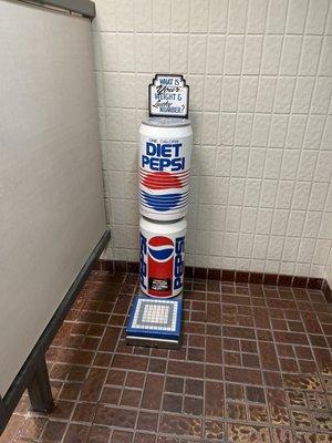 Vintage Diet Pepsi scale in men's room.